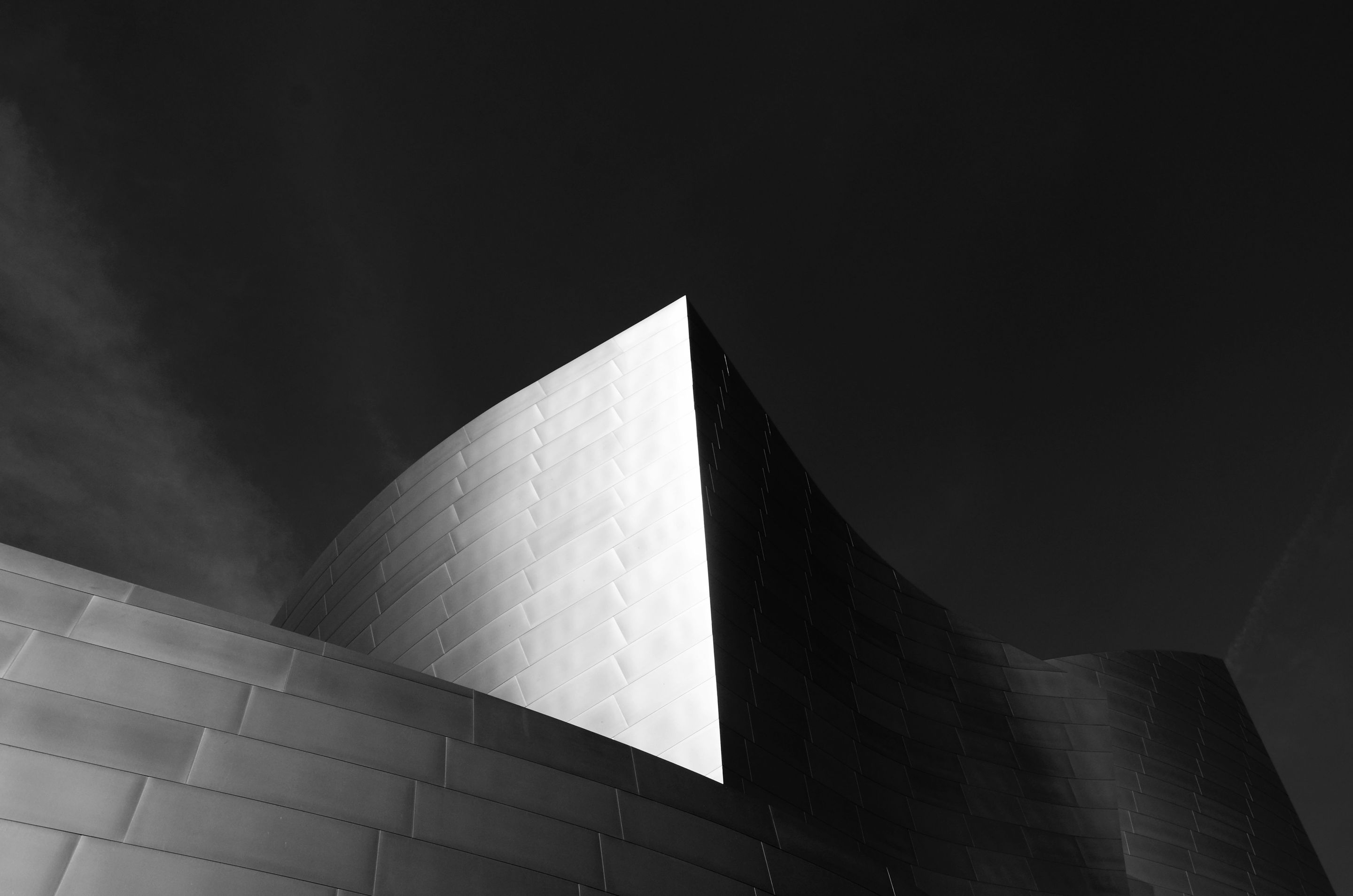 Curved steel facade against a dark sky, Walt Disney Concert Hall