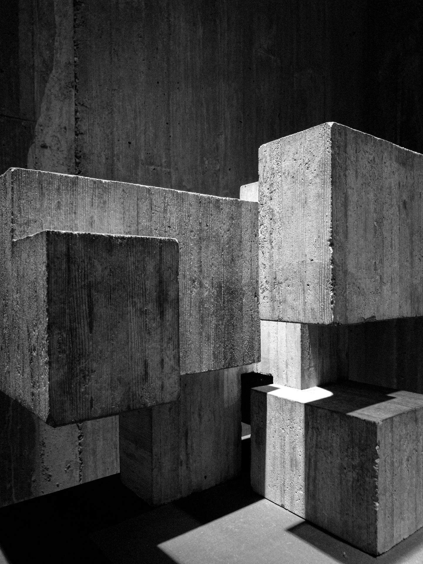 Stacked concrete blocks in hard light and shadow