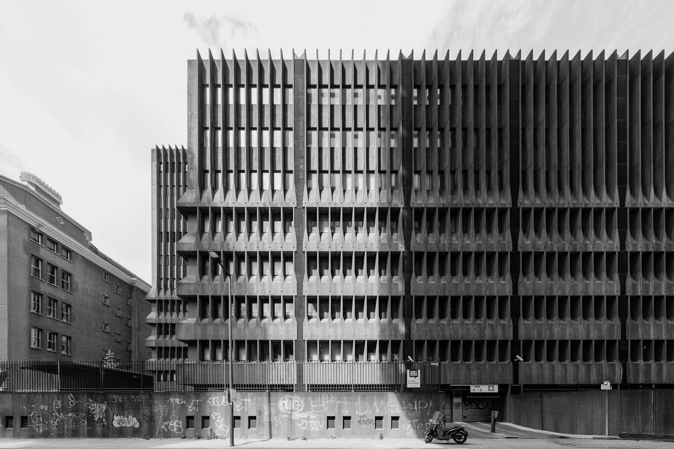 Concrete facade with many vertical fins in black and white